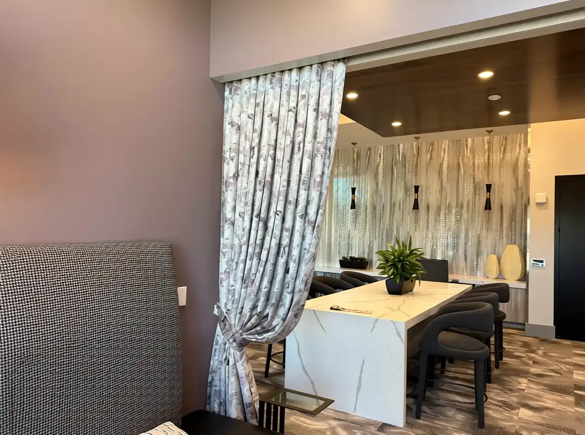 Drapery installation in a tall dining room