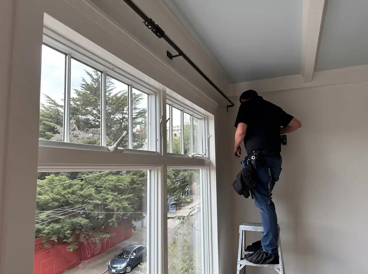 Installer taking care around a residential window