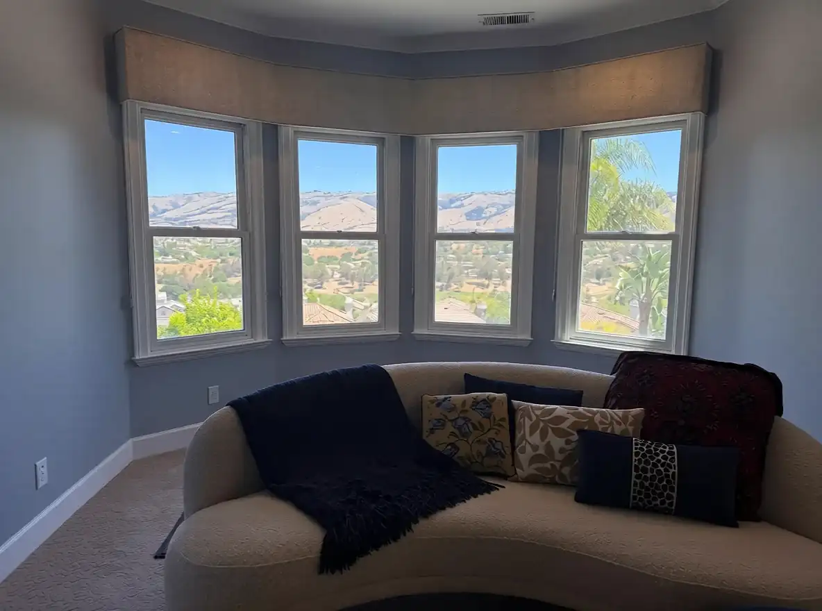 Custom cornice framing a bay window with a wide view