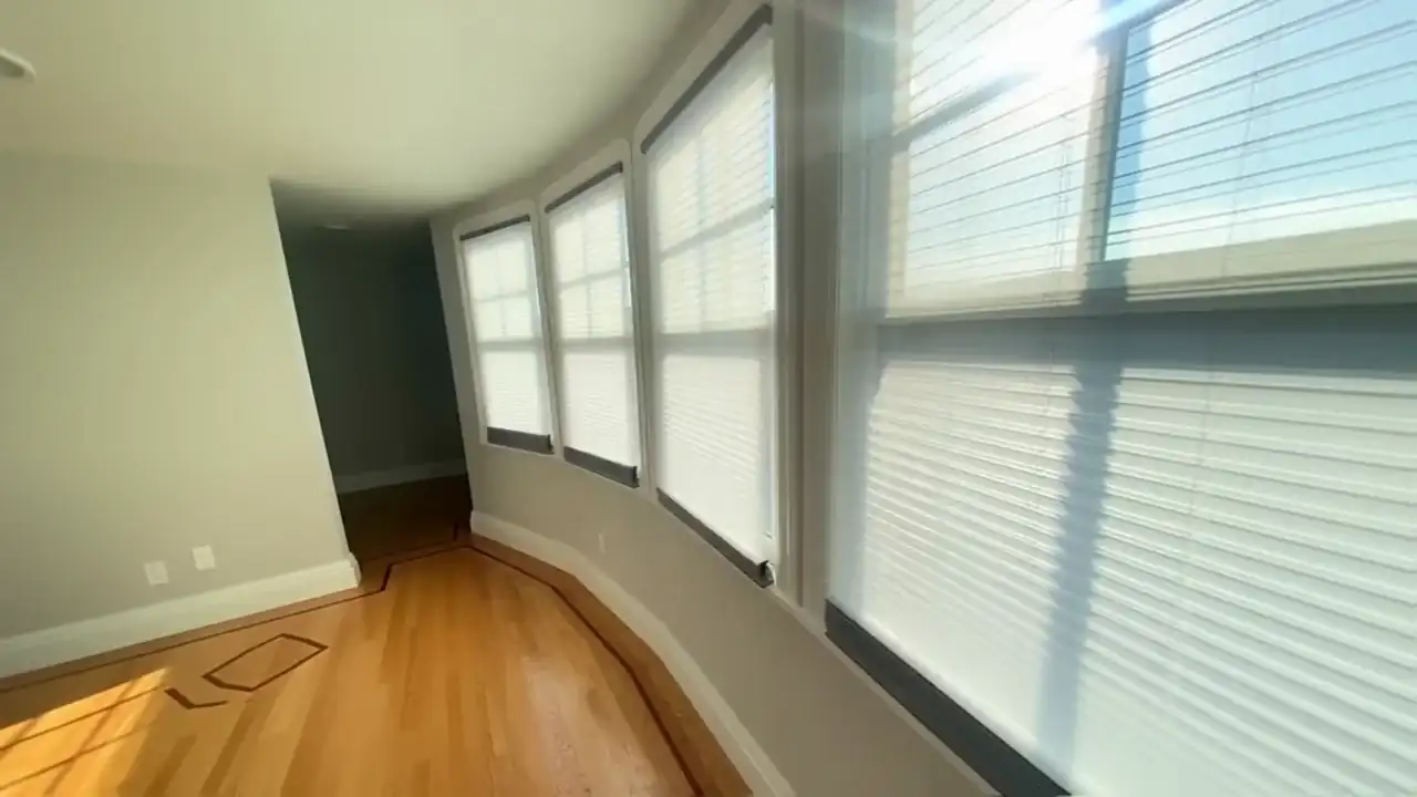 Sunlit bay window fitted with Hunter Douglas cellular shades
